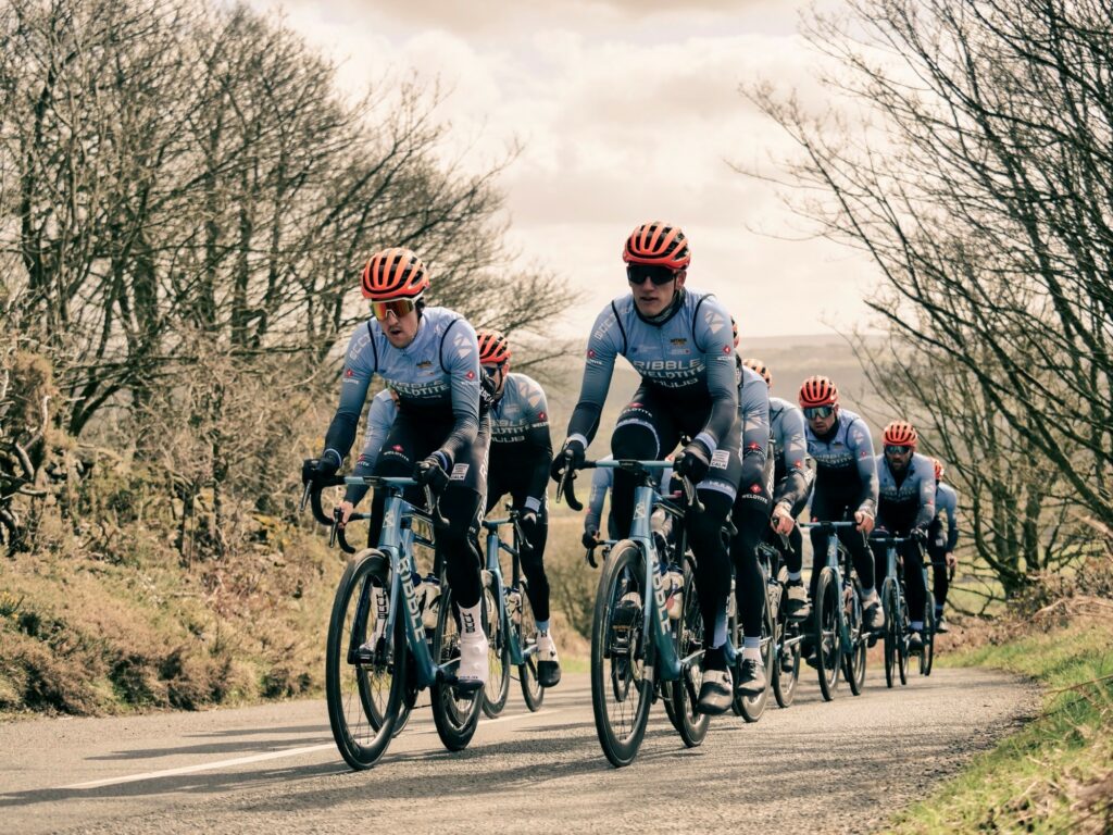 Photo of Freddie riding with his Ribble Weldtite teammates