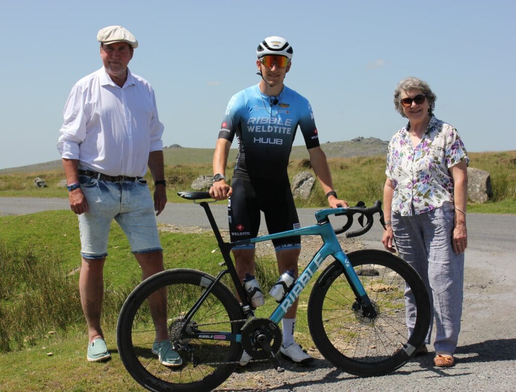 Photo of pro cyclist Freddie Scheske and councillors on Dartmoor